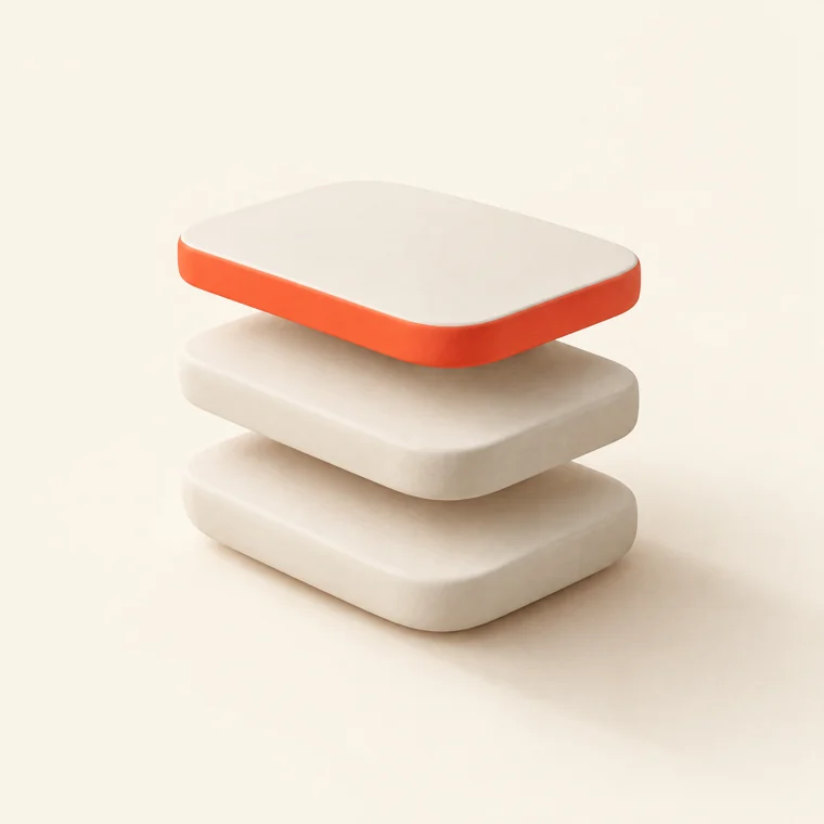 Three stacked ceramic slabs, the top one edged in coral